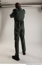 ERIC STANDING POSE WITH GUNS